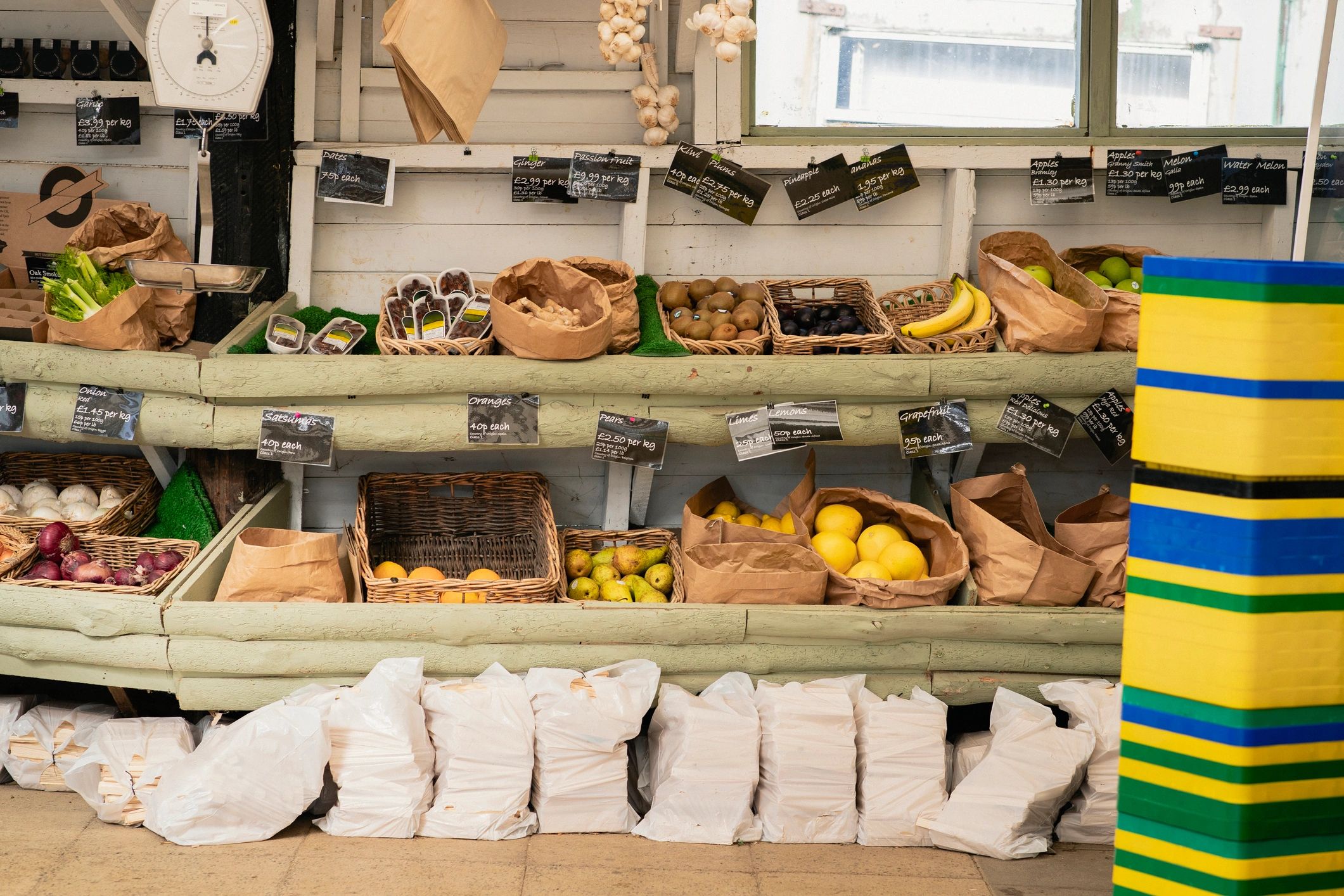Assorted fruit in baskets at a farm stand