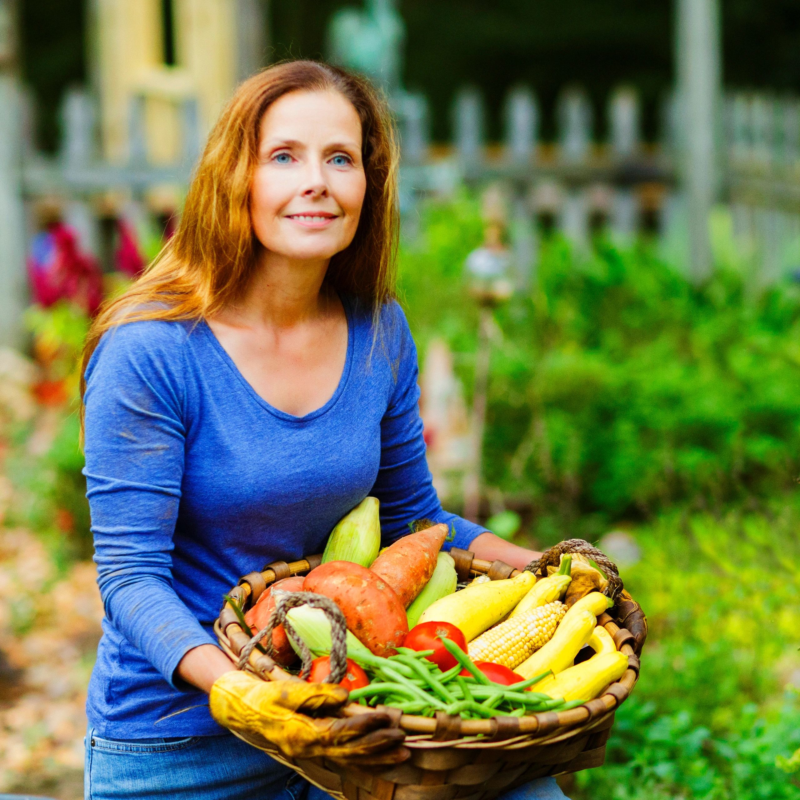 Farm stand team member with vegetables